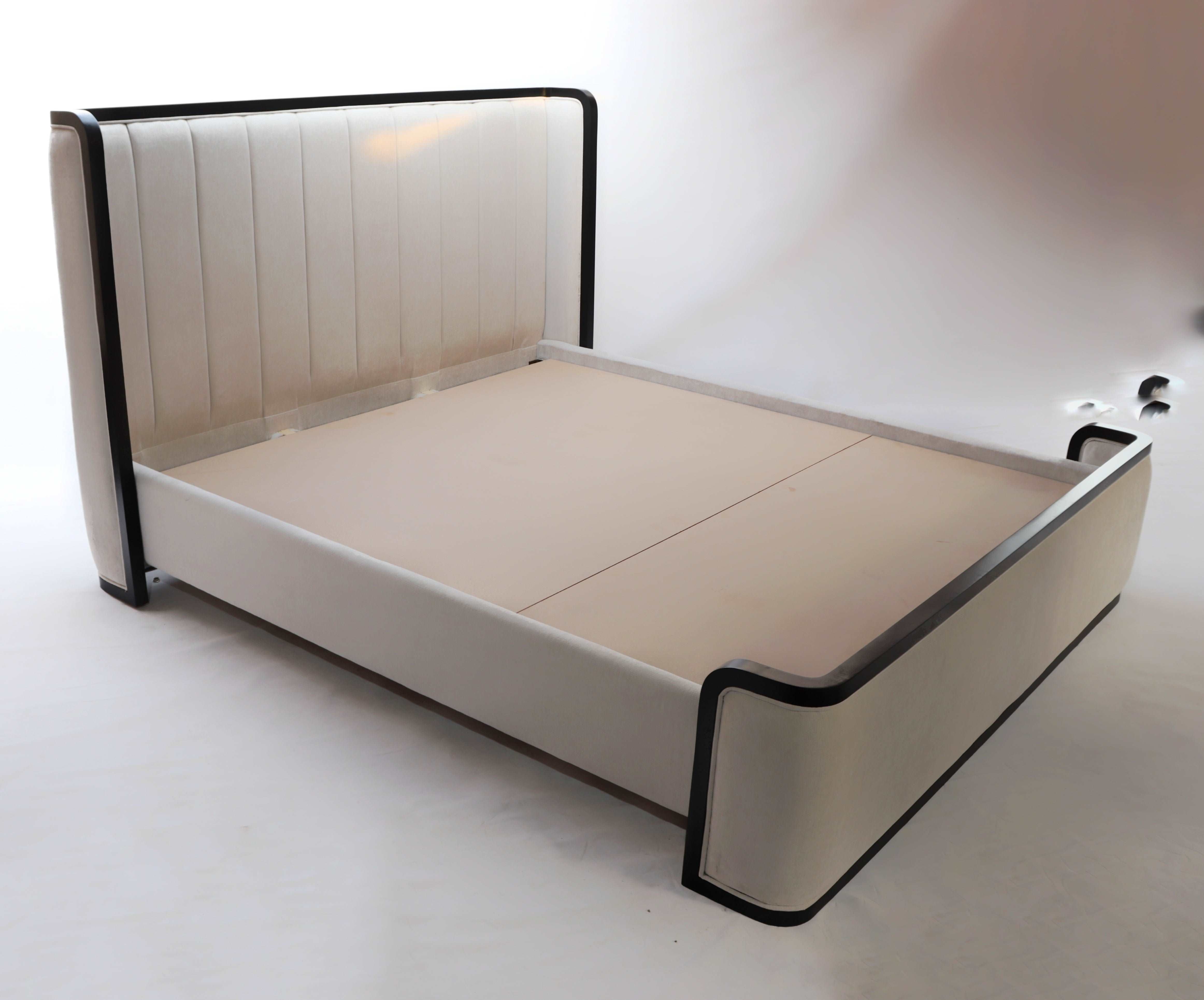 Sumptuous bed featuring solid wood construction and plush tufted upholstery for unparalleled comfort and style.