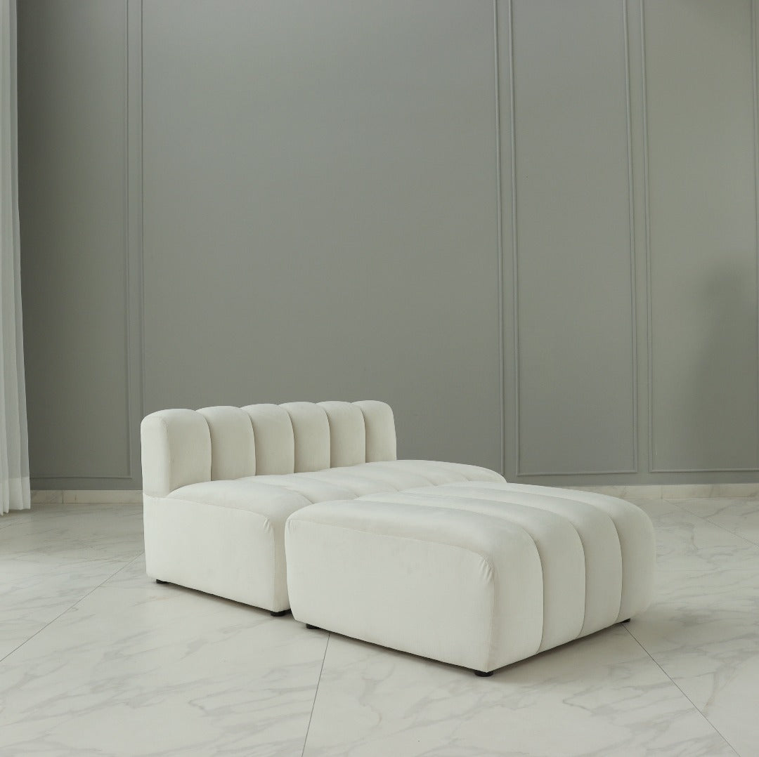 A chic and modular sofa, characterized by its contemporary design and versatile configuration options. Its sleek lines and modular components allow for customizable arrangements, providing both style and flexibility to adapt to various living spaces and seating preferences.