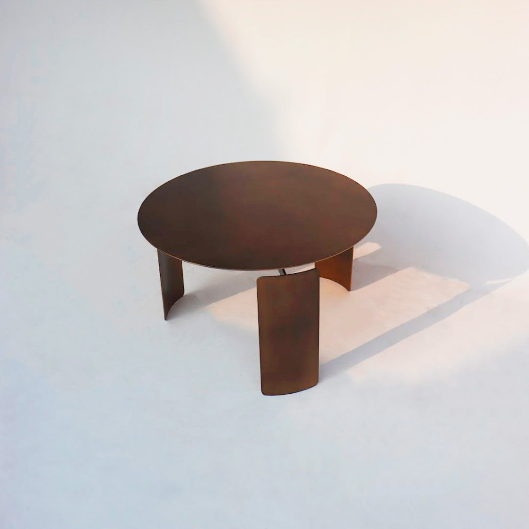 A nested set of industrial minimal coffee tables, featuring sleek lines and minimalist design. These tables offer versatility and functionality with their nested configuration, making them perfect for modern living spaces with a touch of industrial style.