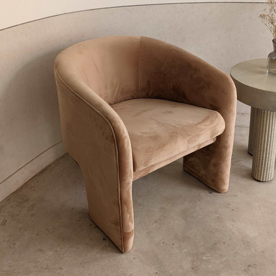 "Low back accent chair with a fully upholstered design and tapered seat for comfortable and easy seating.