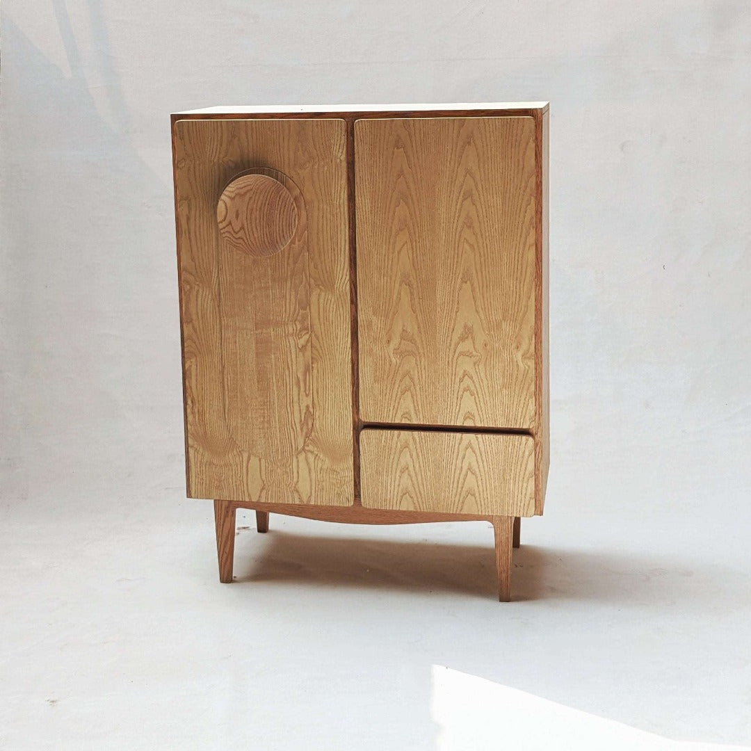 Functional Cabinet: Featuring shelves and a drawer for convenient storage.