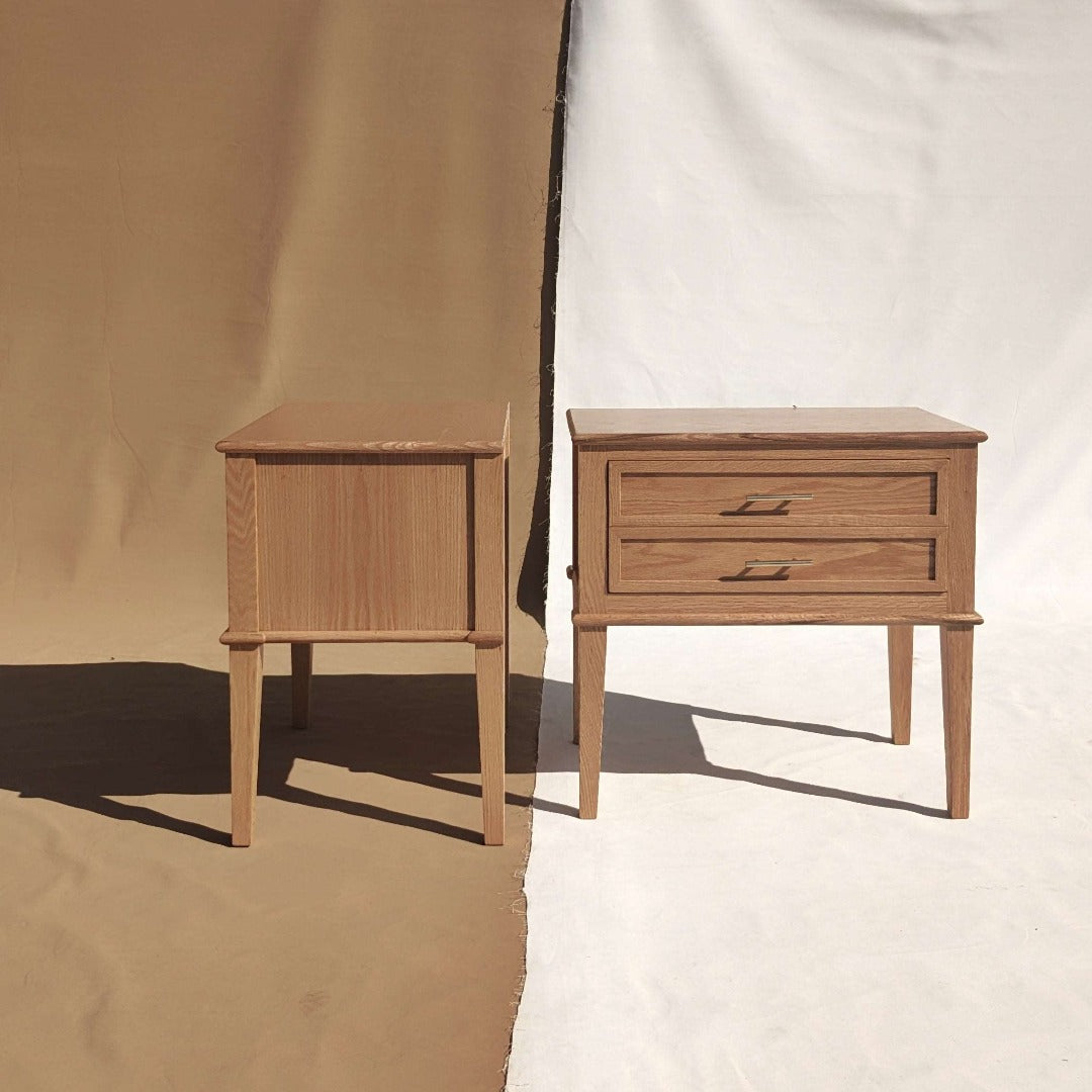 Graceful and refined side table crafted from Solid Red Oak and Red Oak veneer, accented with brass handles for an exquisite touch of sophistication.