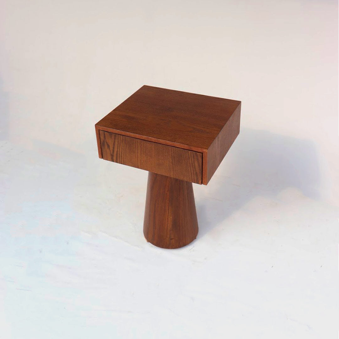 Nightstands featuring conical bases and rectangular tops crafted from wood, combining modern design with classic functionality. The conical bases provide stability and visual interest, while the wooden tops offer ample surface area for bedside essentials, blending seamlessly with various bedroom decor styles.