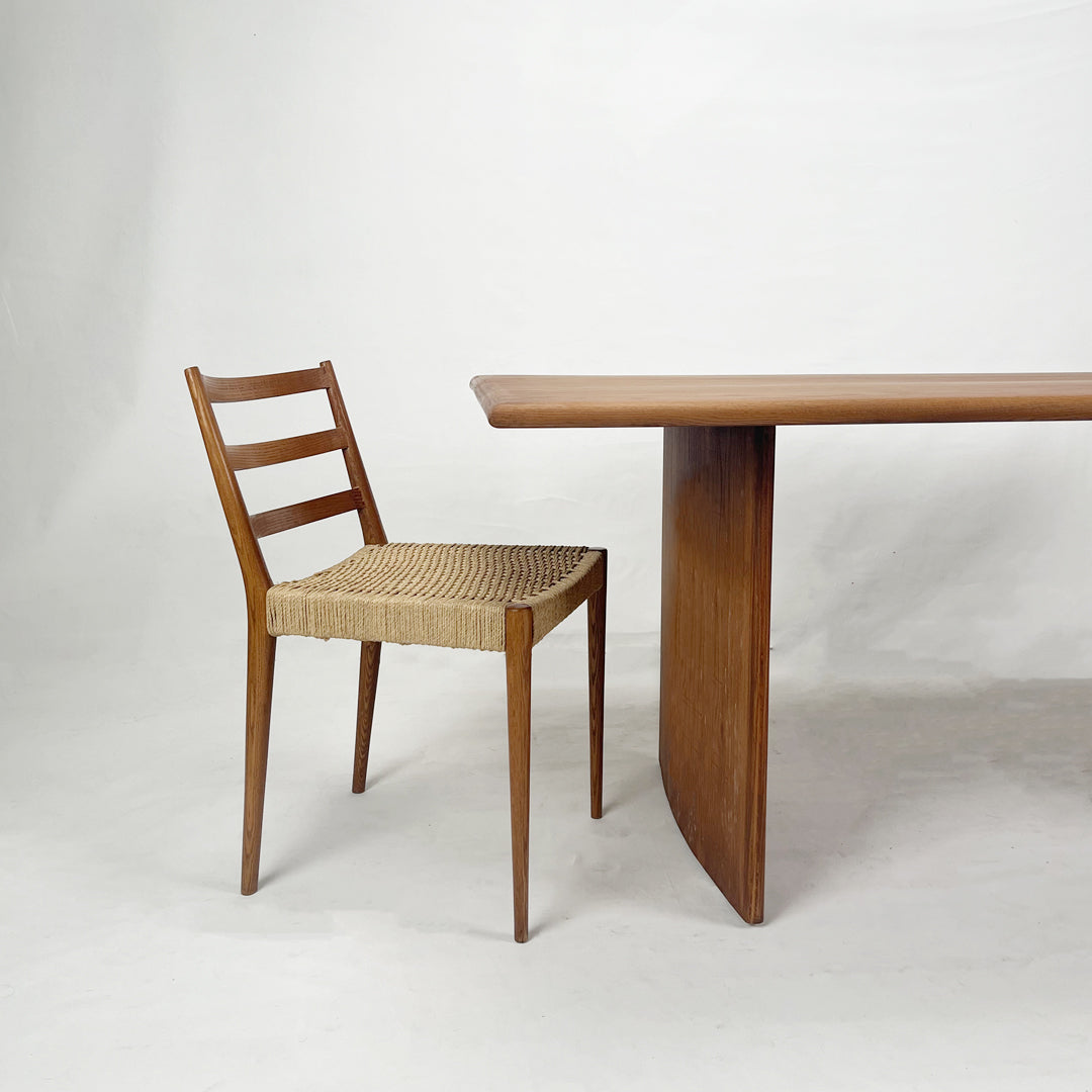 Masterfully crafted statement dining table showcasing intricate wood joinery techniques for a stunning and enduring centerpiece.