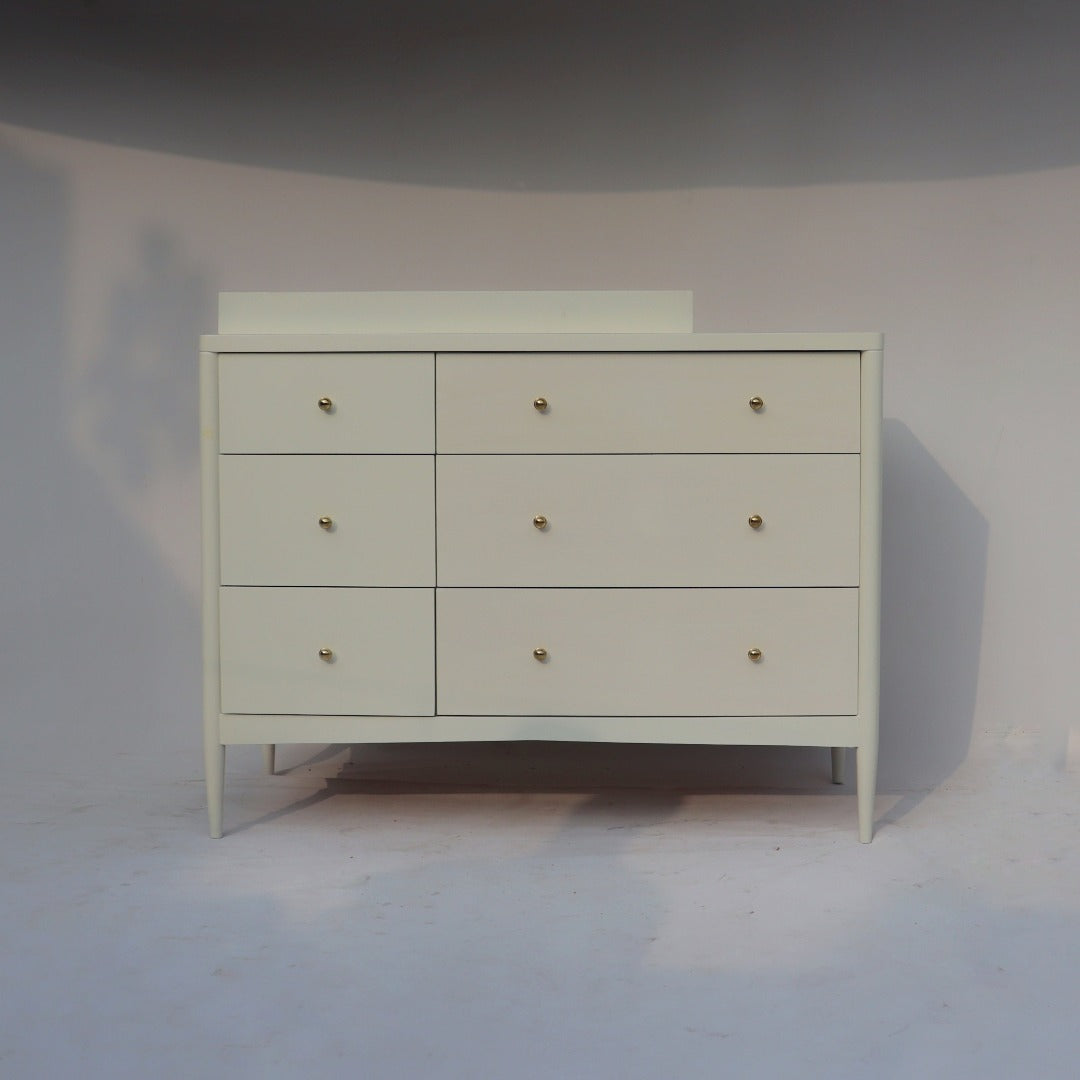 Functional and stylish dresser ideal for nursery or kids' room, offering ample storage space for essentials.