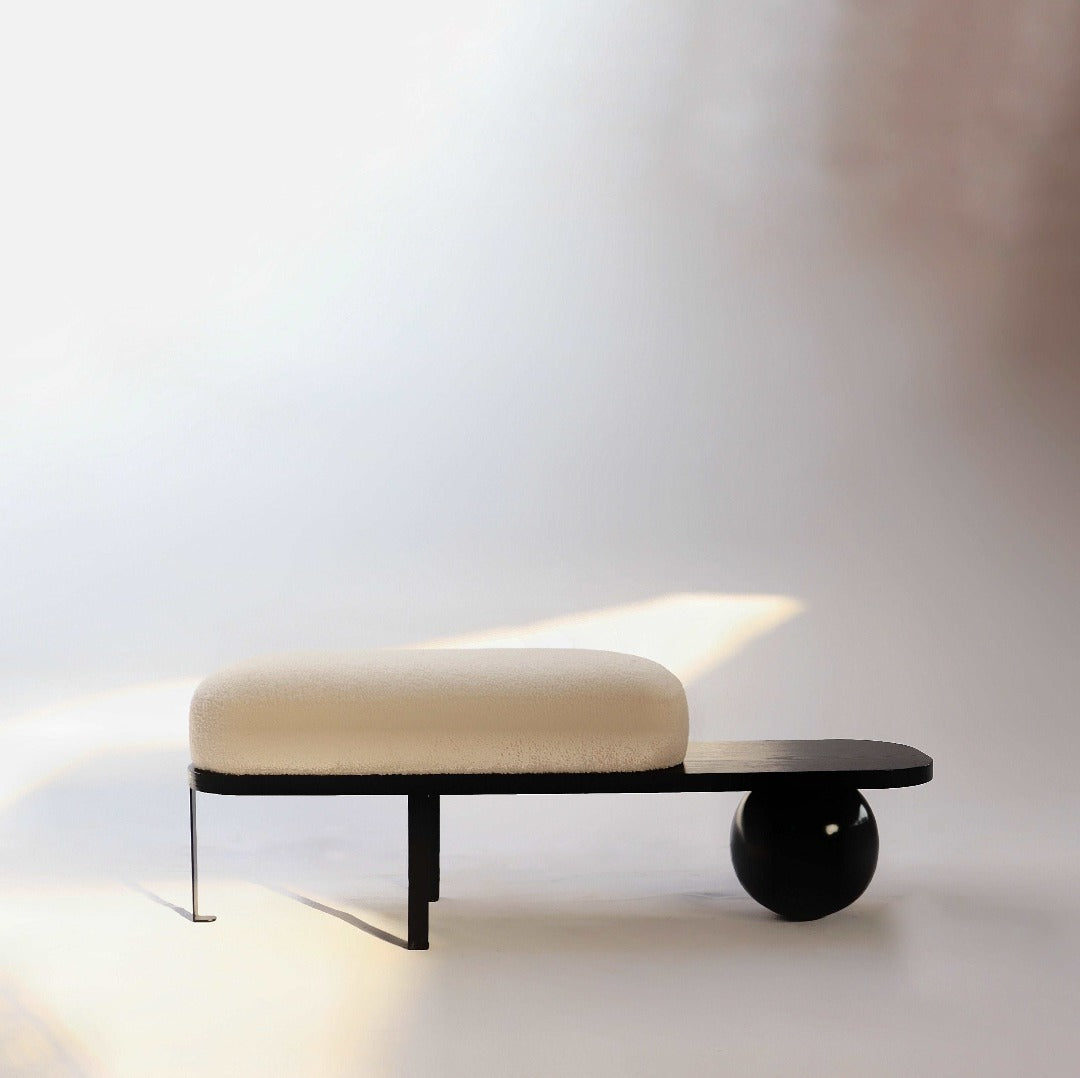 The Orb Bench: A versatile piece blending practicality with sculptural elegance, perfect for any space