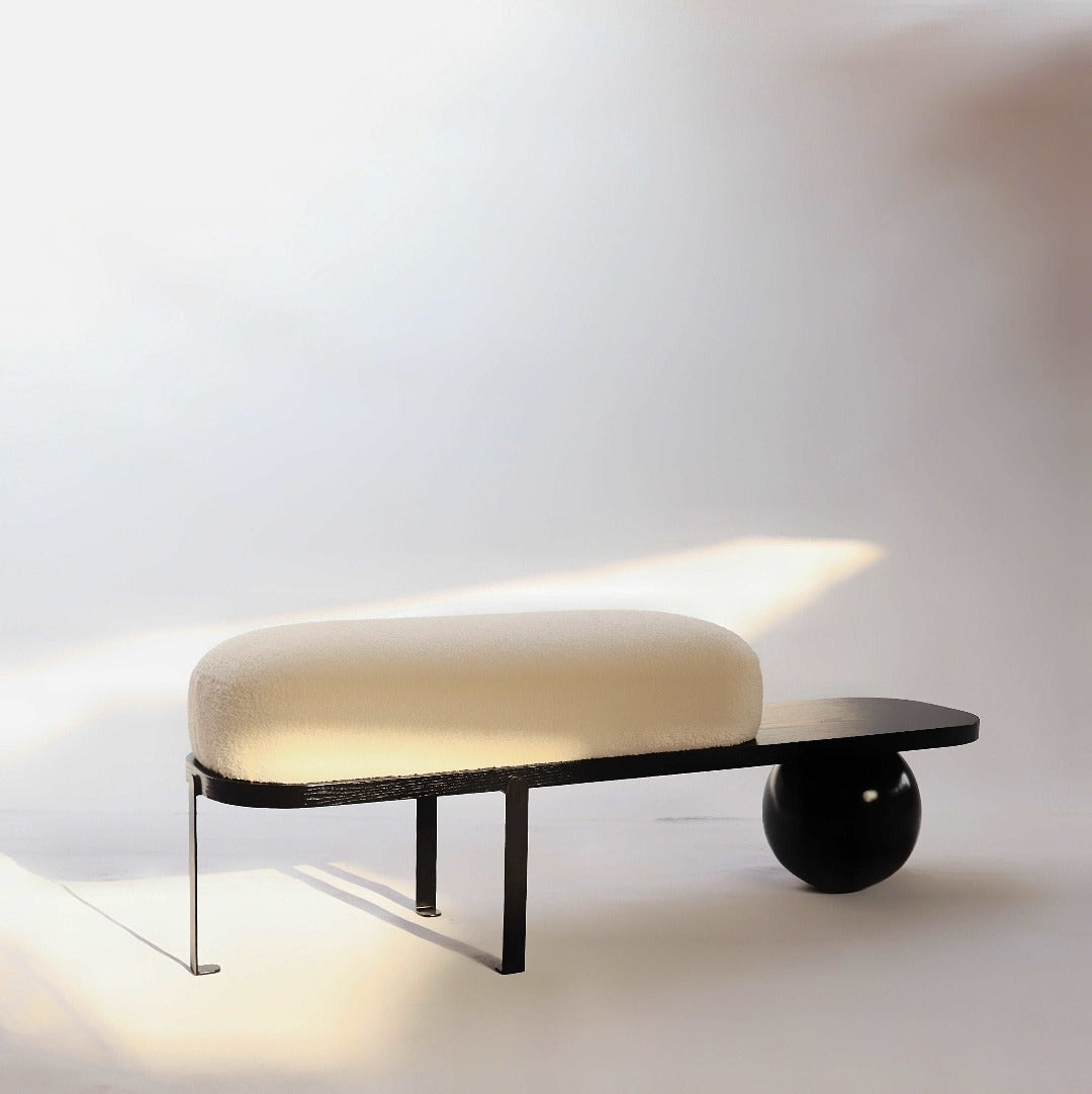 The Orb Bench: A versatile piece blending practicality with sculptural elegance, perfect for any space