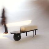 The Orb Bench: A versatile piece blending practicality with sculptural elegance, perfect for any space