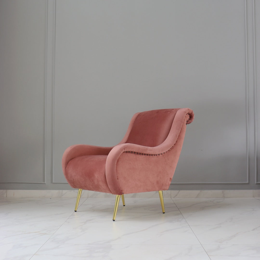 A wing chair, featuring a high back and distinctive winged sides that curve gracefully towards the arms. Upholstered in soft fabric or leather, it offers both comfort and elegance, making it a timeless addition to any living space.