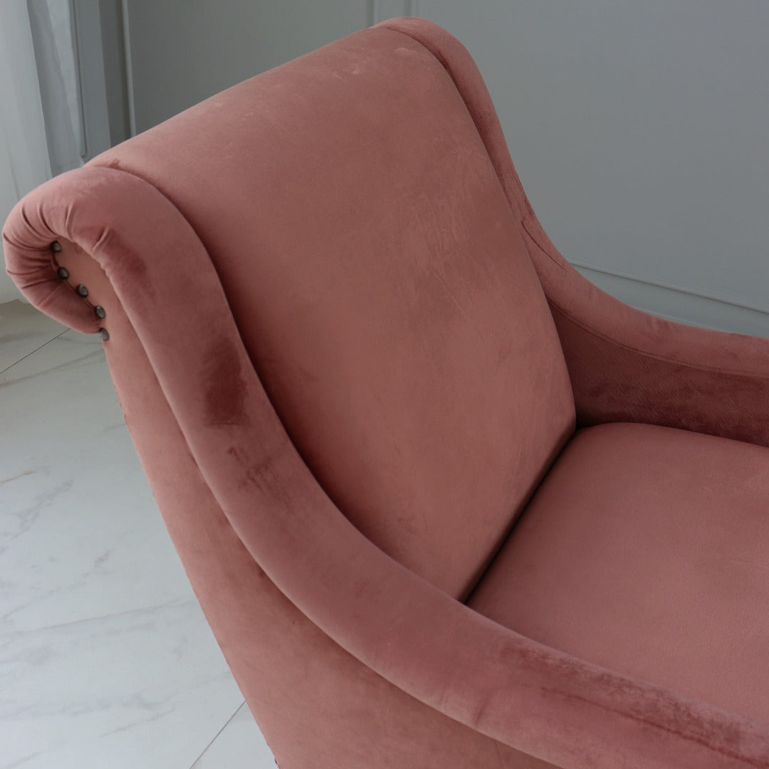 A wing chair, featuring a high back and distinctive winged sides that curve gracefully towards the arms. Upholstered in soft fabric or leather, it offers both comfort and elegance, making it a timeless addition to any living space.