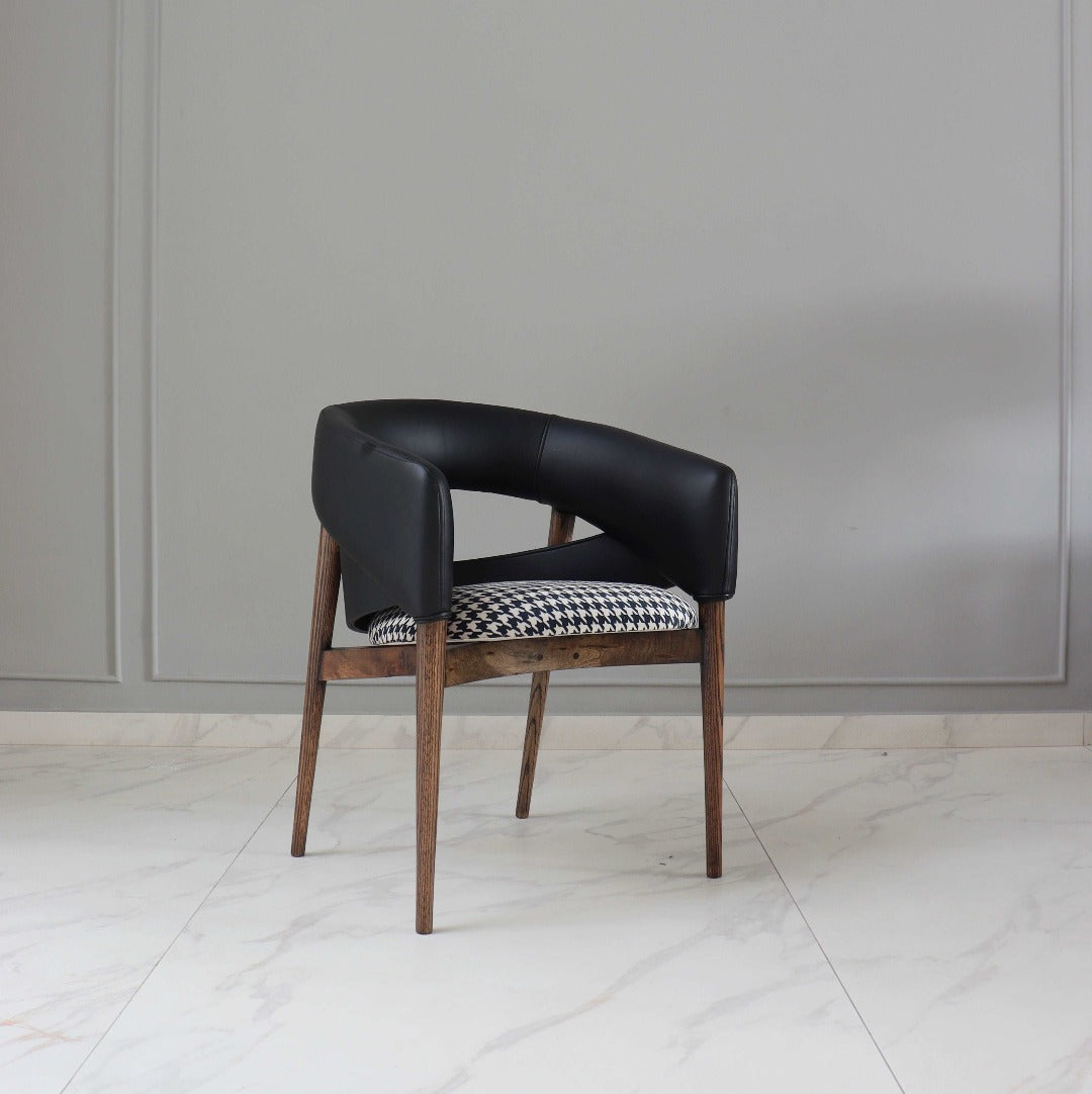 Experience contemporary elegance with our stylish dining chair, expertly crafted from solid wood and bent plywood. Its seamless blend of modern design and natural materials adds sophistication to any dining space.
