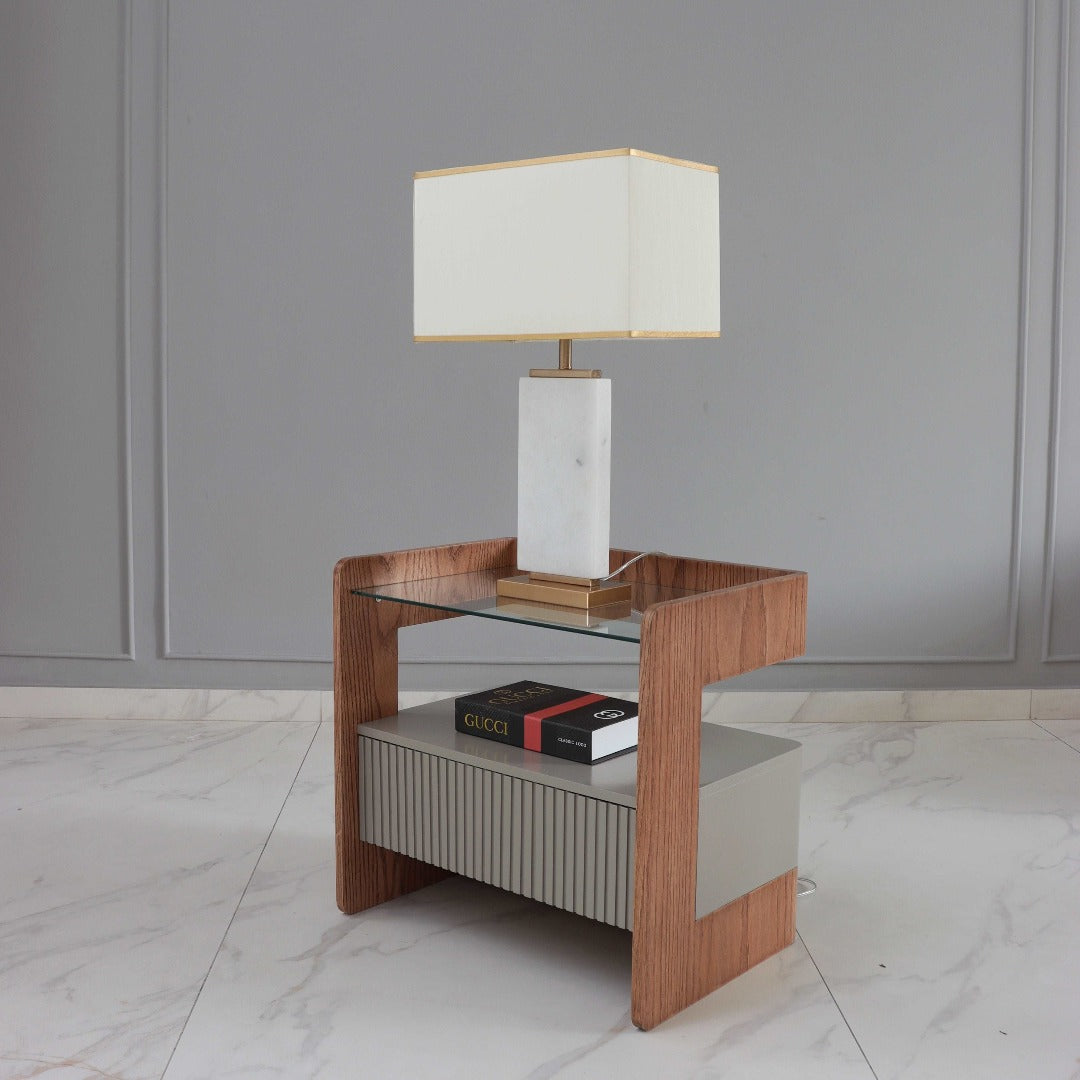 Sleek nightstand crafted from glass, red oak veneer, and Duco painted finish for a contemporary and stylish addition to your bedroom.