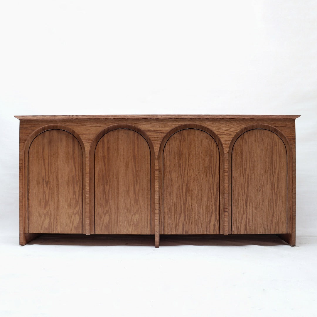 Elevate your space with our Statement Sideboard, crafted from premium red oak veneer and solid red oak. Designed with an arch as a nod to classic furniture, its elegant yet simple design offers ample storage while making a stylish statement in your home.