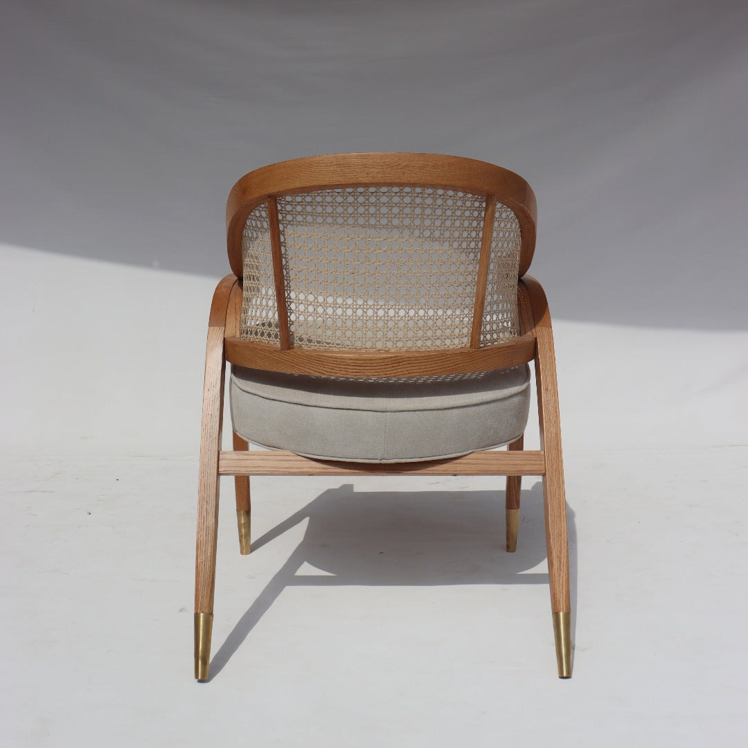 Crafted with precision and artistry, the Edward Wormley Chair blends solid red oak, brass fittings, and hand-woven rattan for a timeless and elegant design.