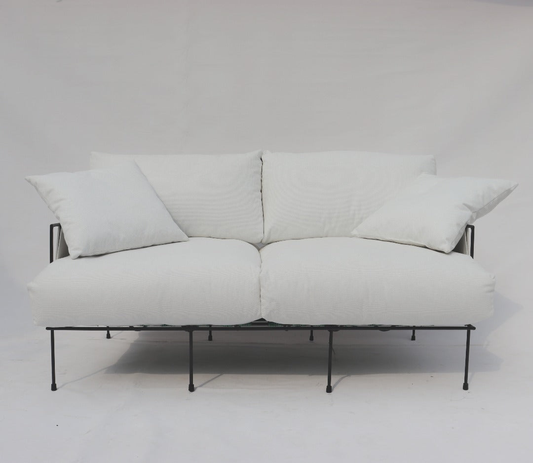 Sofa with a comfortable design for sinking in and relaxing, complemented by a lightweight construction and minimalistic style that seamlessly blends with any decor.