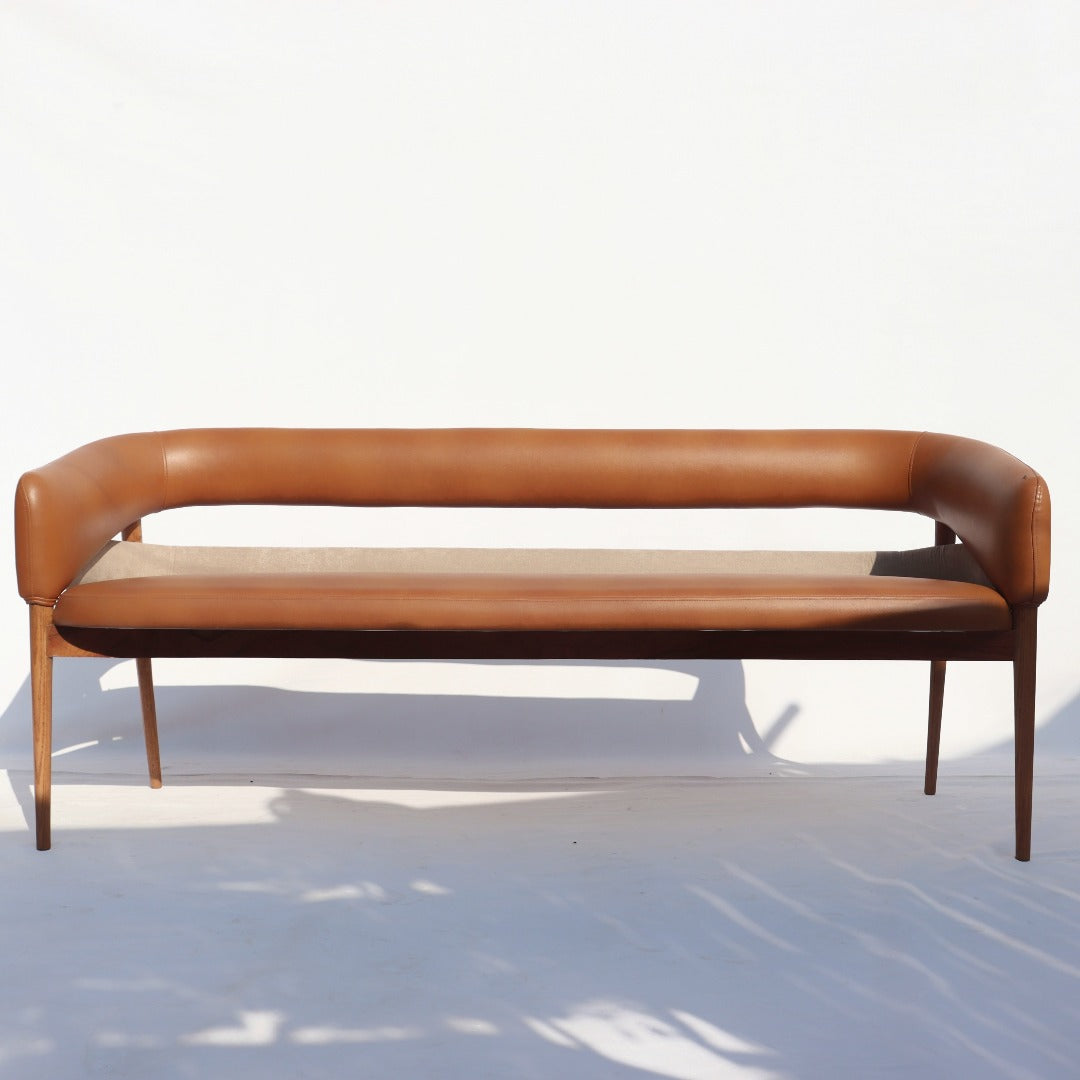 Indulge in sophistication with our sleek and stylish bench, crafted from elegant red oak and adorned with luxurious leatherette upholstery. Elevate your space with timeless charm.