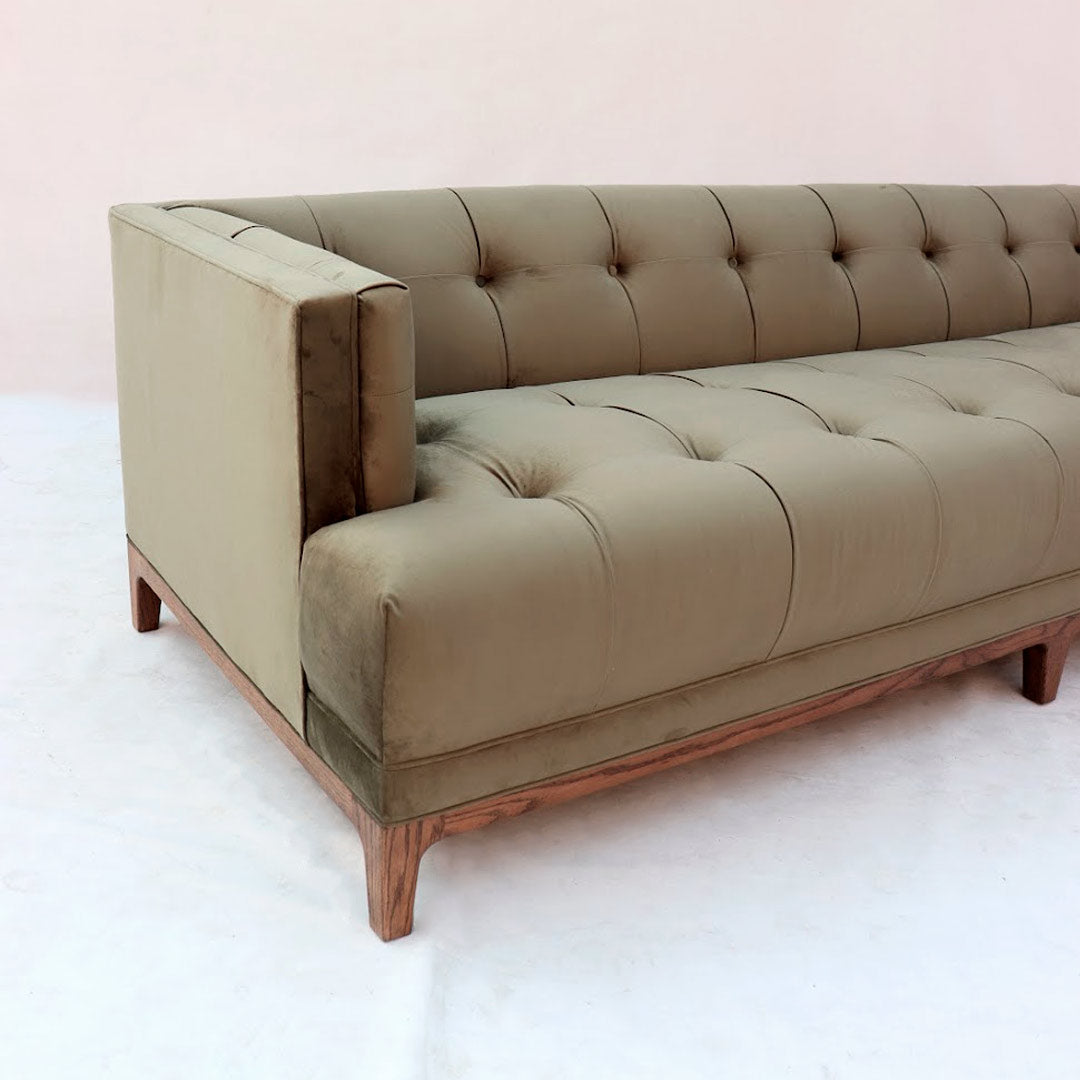 "Modern tuxedo sofa with clean lines and velvet upholstery"