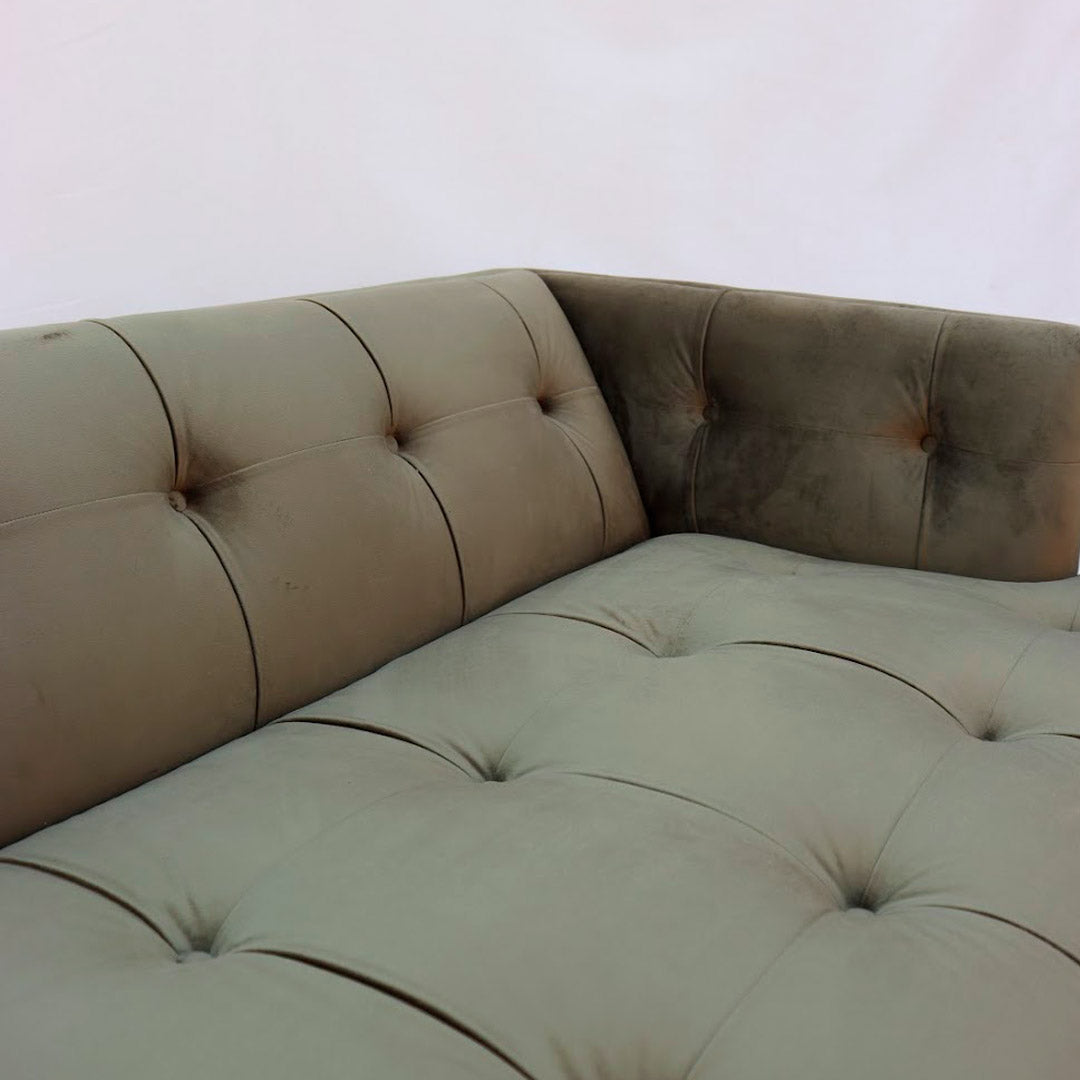 "Modern tuxedo sofa with clean lines and velvet upholstery"