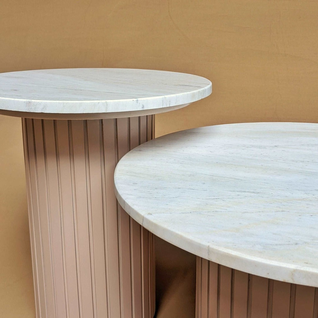 Sleek round coffee table featuring a luxurious marble top for an elegant touch.