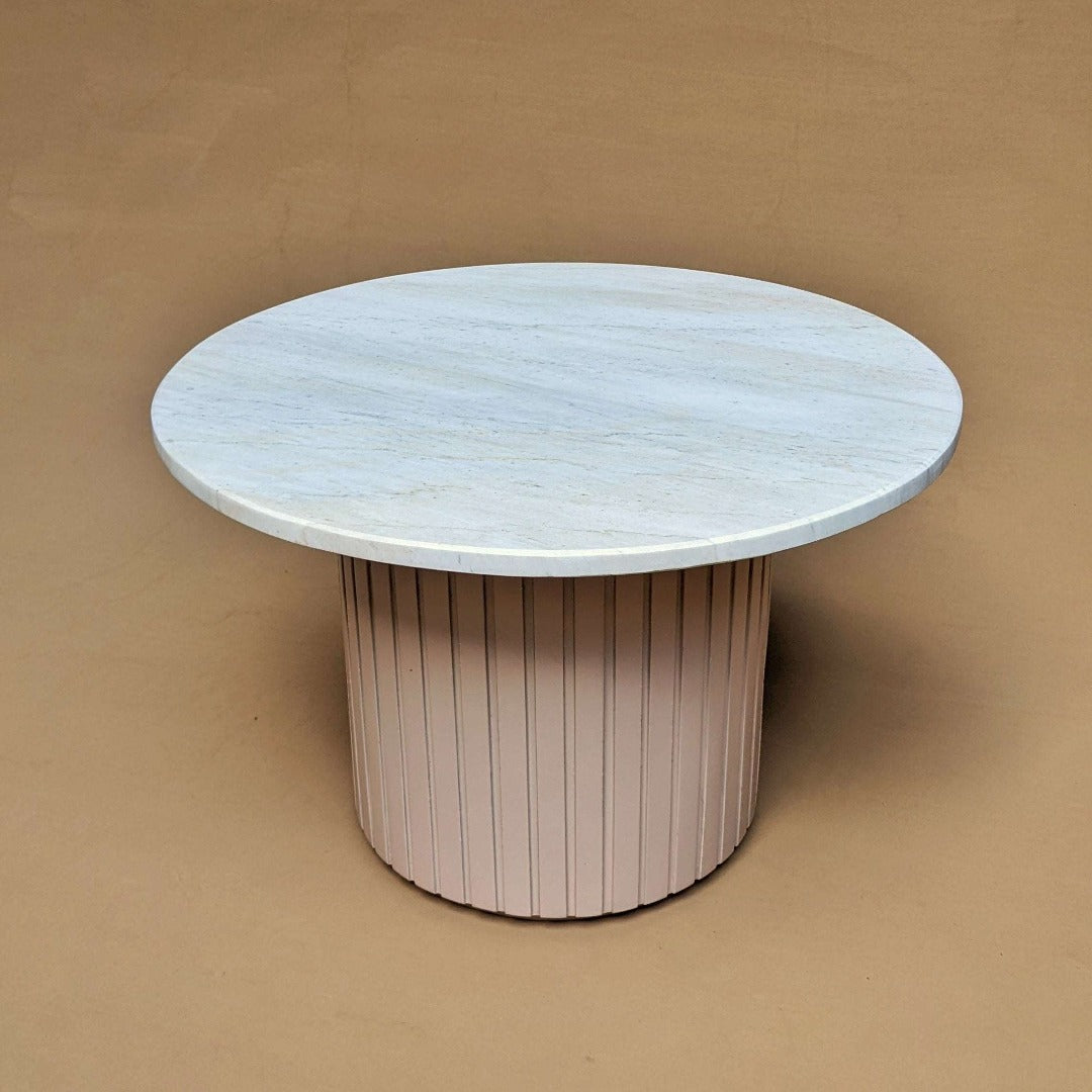 Sleek round coffee table featuring a luxurious marble top for an elegant touch.