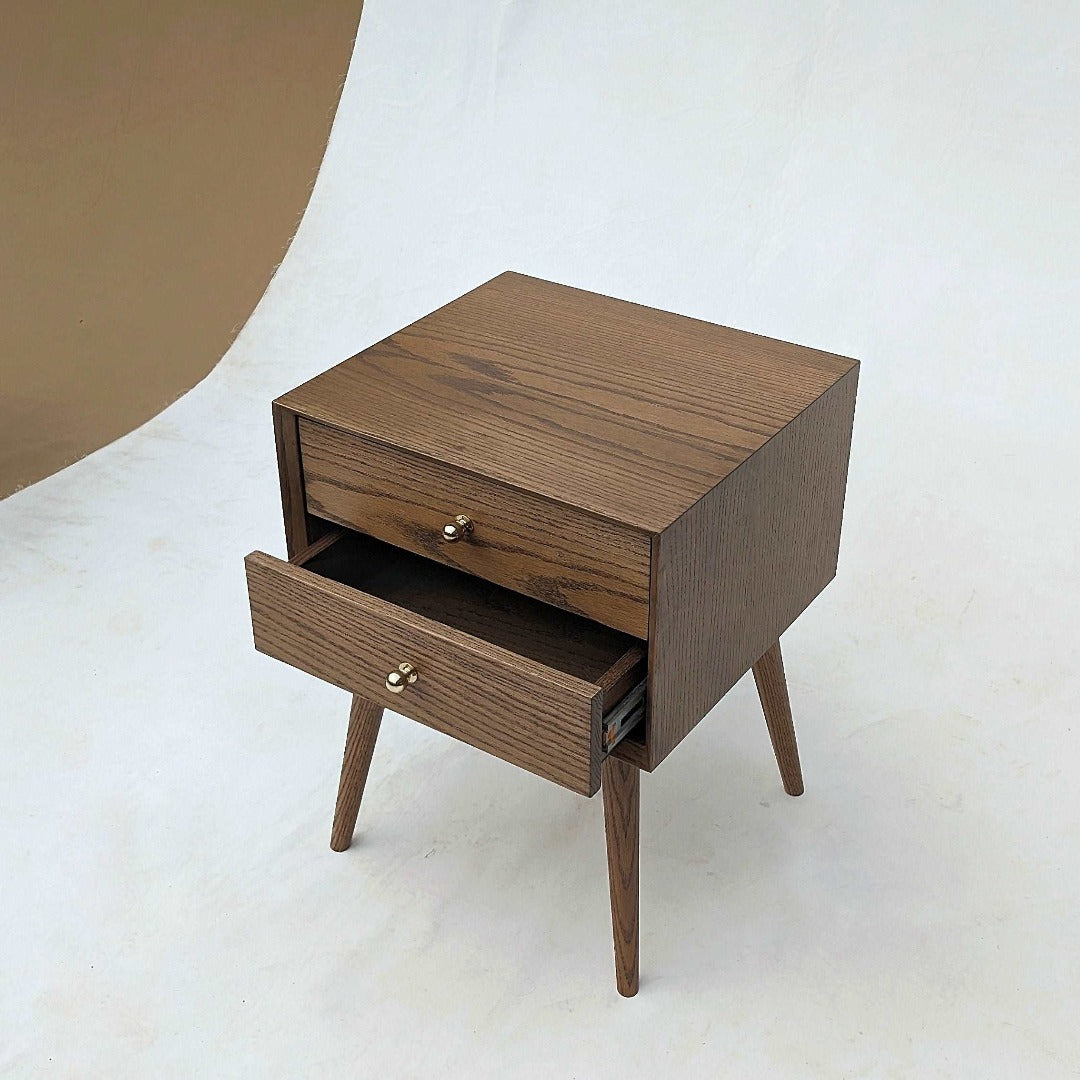 Mid-century modern design nightstands featuring a red oak veneer for a classic and stylish aesthetic.