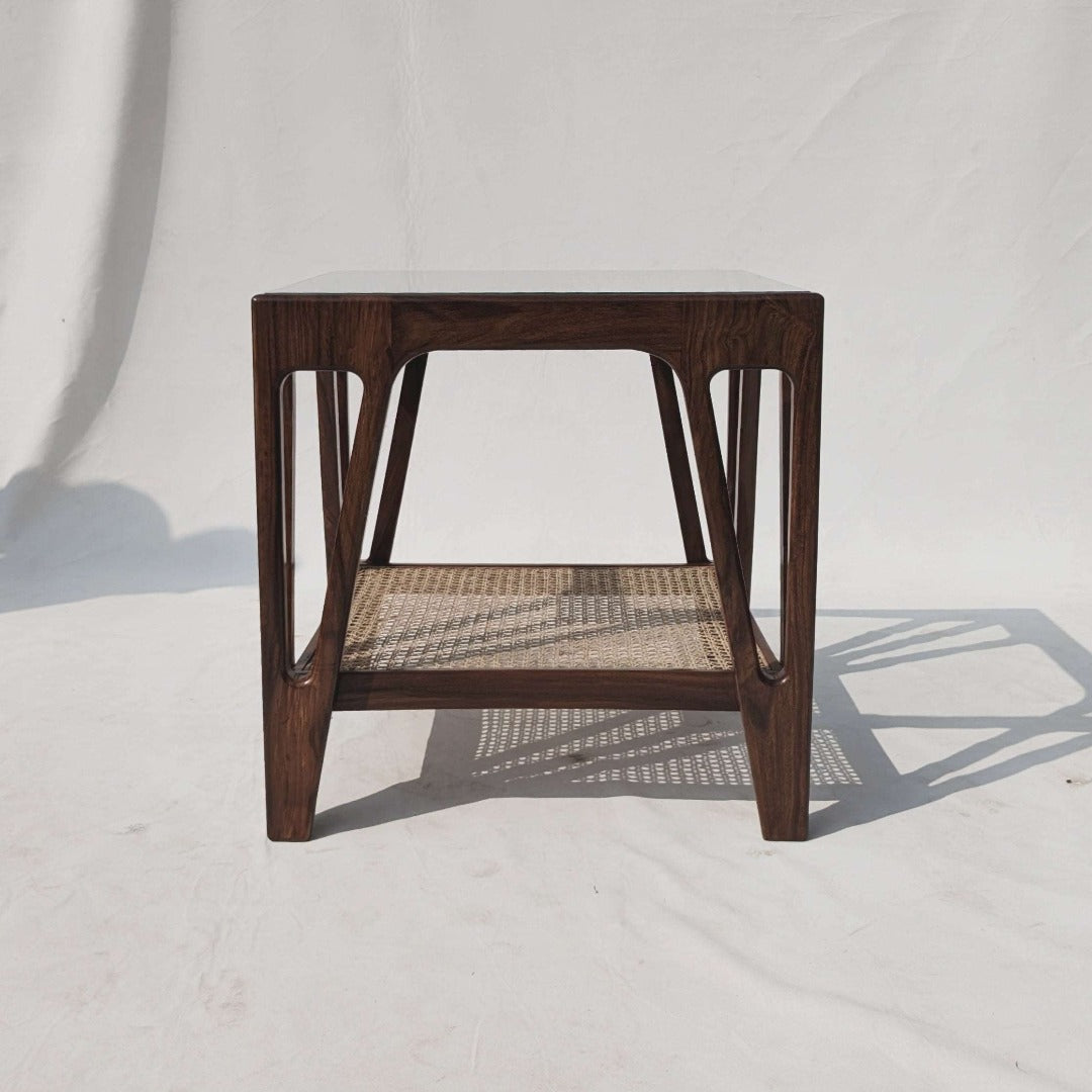 Elevate your space with our Cane End Table, expertly crafted from solid Indian rosewood and adorned with handcrafted rattan webbing. A fusion of natural beauty and artisanal craftsmanship, perfect for adding warmth and texture to any room.