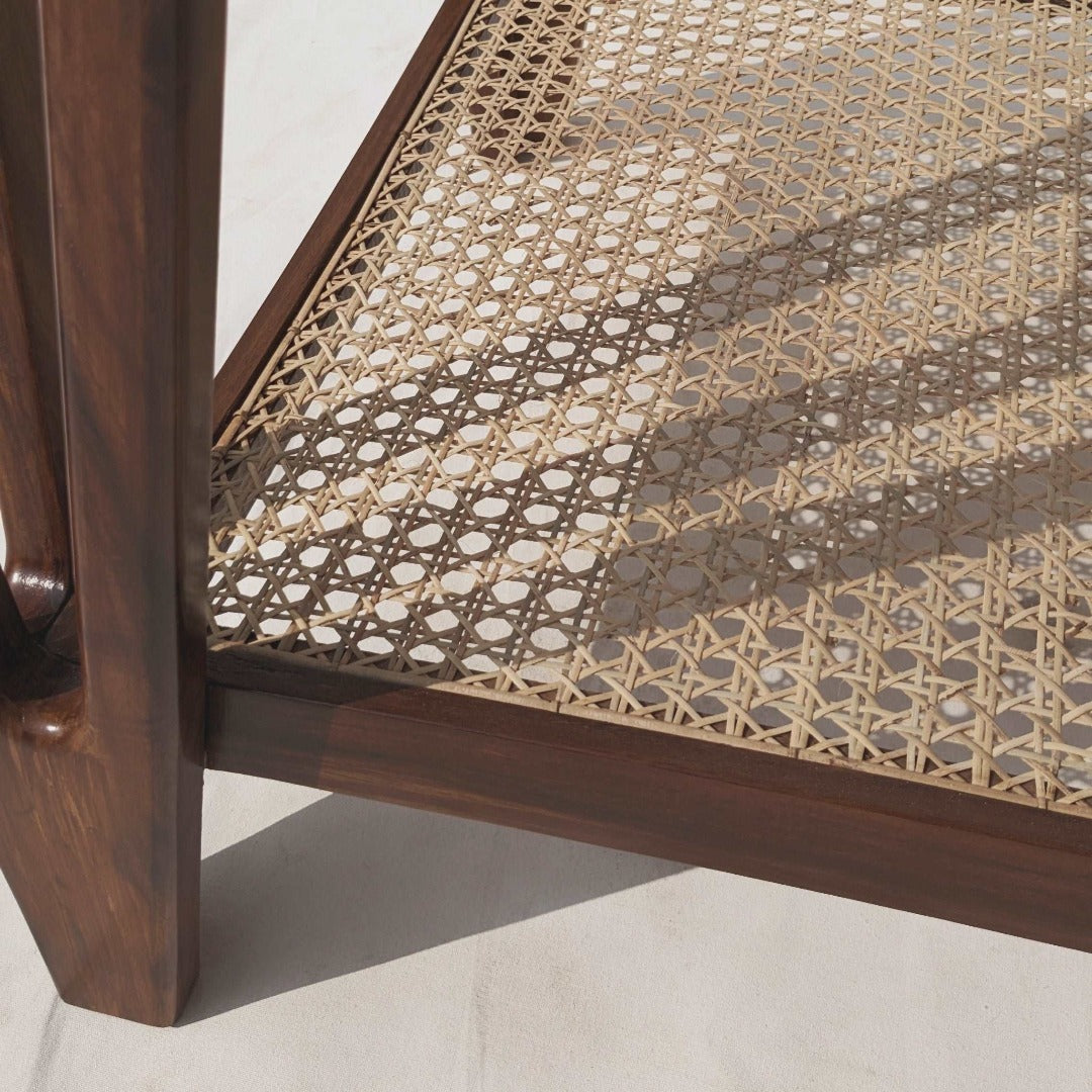 Elevate your space with our Cane End Table, expertly crafted from solid Indian rosewood and adorned with handcrafted rattan webbing. A fusion of natural beauty and artisanal craftsmanship, perfect for adding warmth and texture to any room.