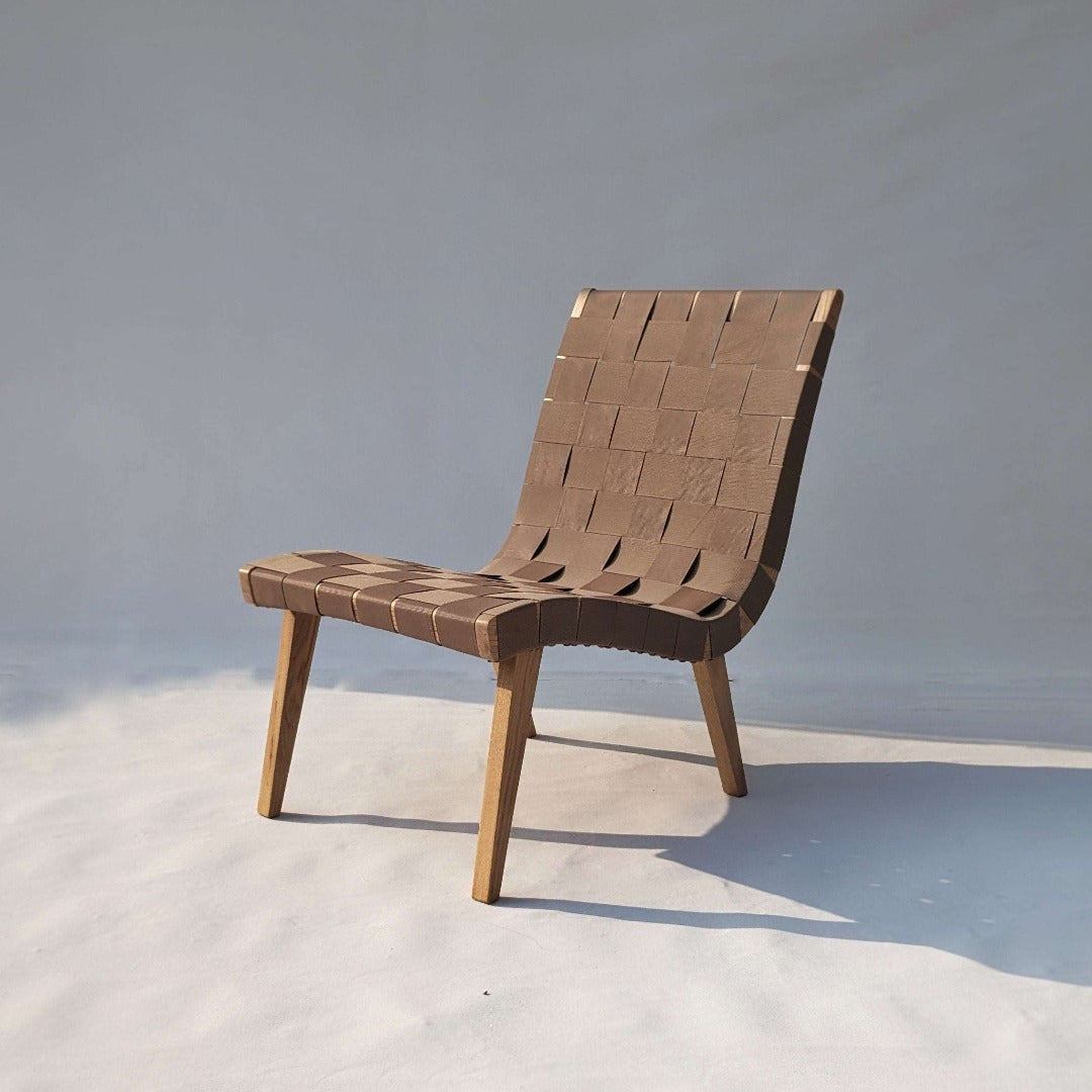 The epitome of comfort: a perfect lounging chair crafted from solid wood, enhanced with German outdoor coatings and waterproof webbing for unparalleled durability and relaxation.