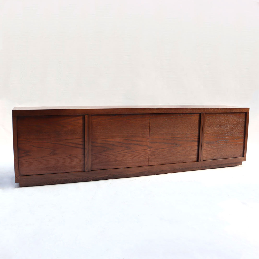 A robust, dark-toned wooden console featuring ample storage compartments, exuding a rugged yet sophisticated aesthetic.