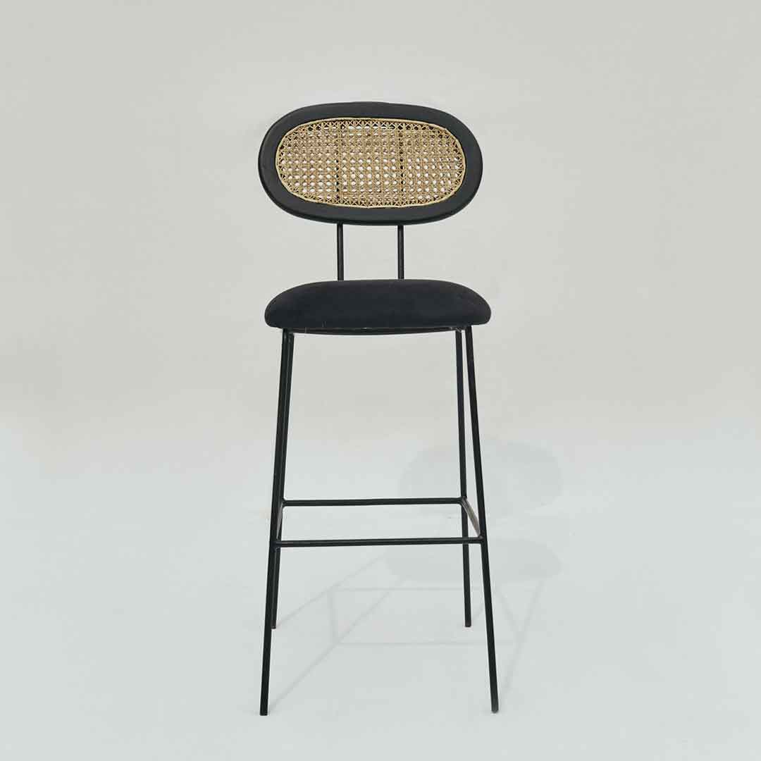 Bar stool featuring a perfect blend of steel, wood, and cane for a harmonious combination of modern and natural elements.