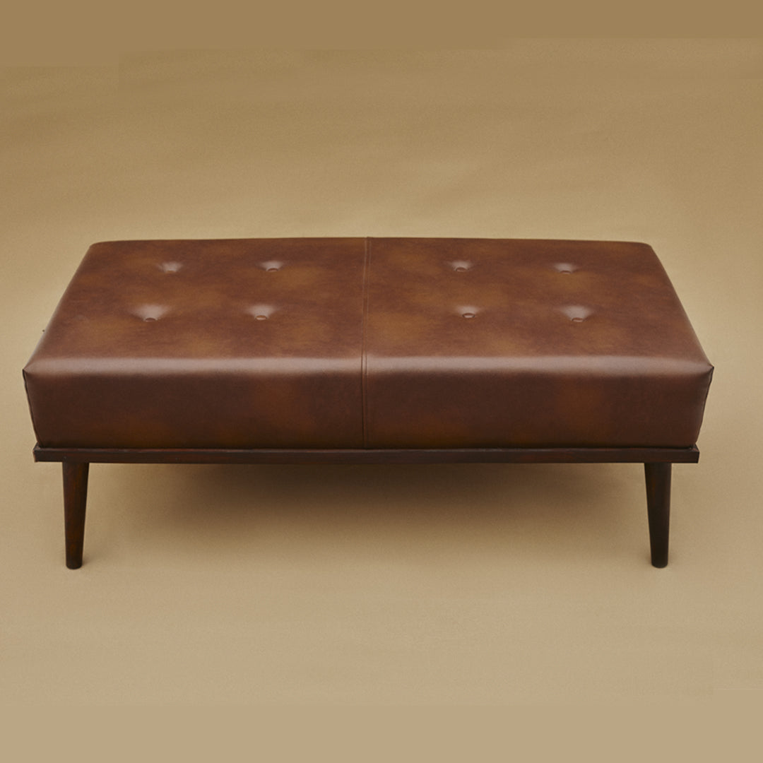 Indulge in luxury with our Ottoman, crafted from high-quality Leatherite and Solid Indian Rosewood. Elevate your space with its exquisite blend of sophistication and durability.