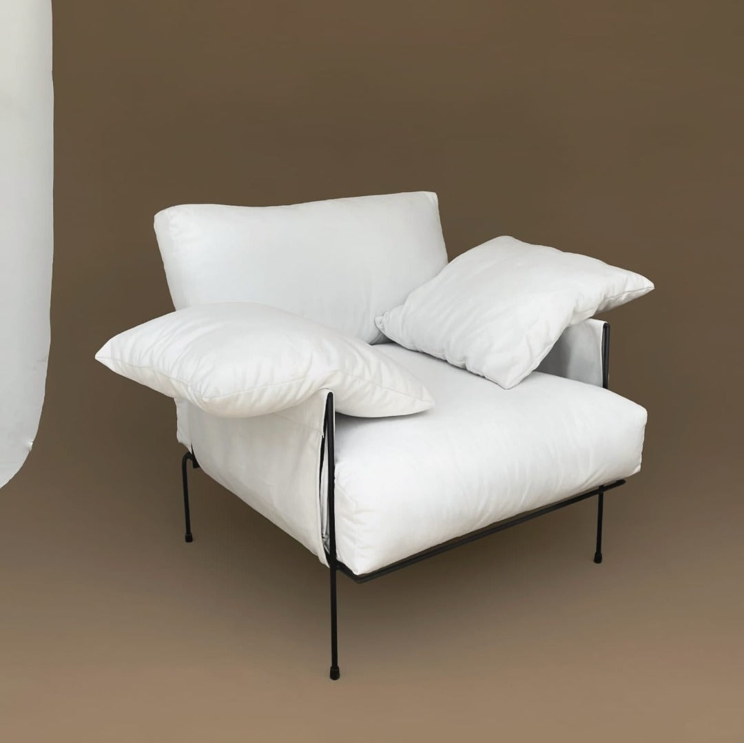Contemporary Lounge chair featuring a sleek, minimal design for added comfort and style. Includes removable, washable cushion covers for easy maintenance and versatility.