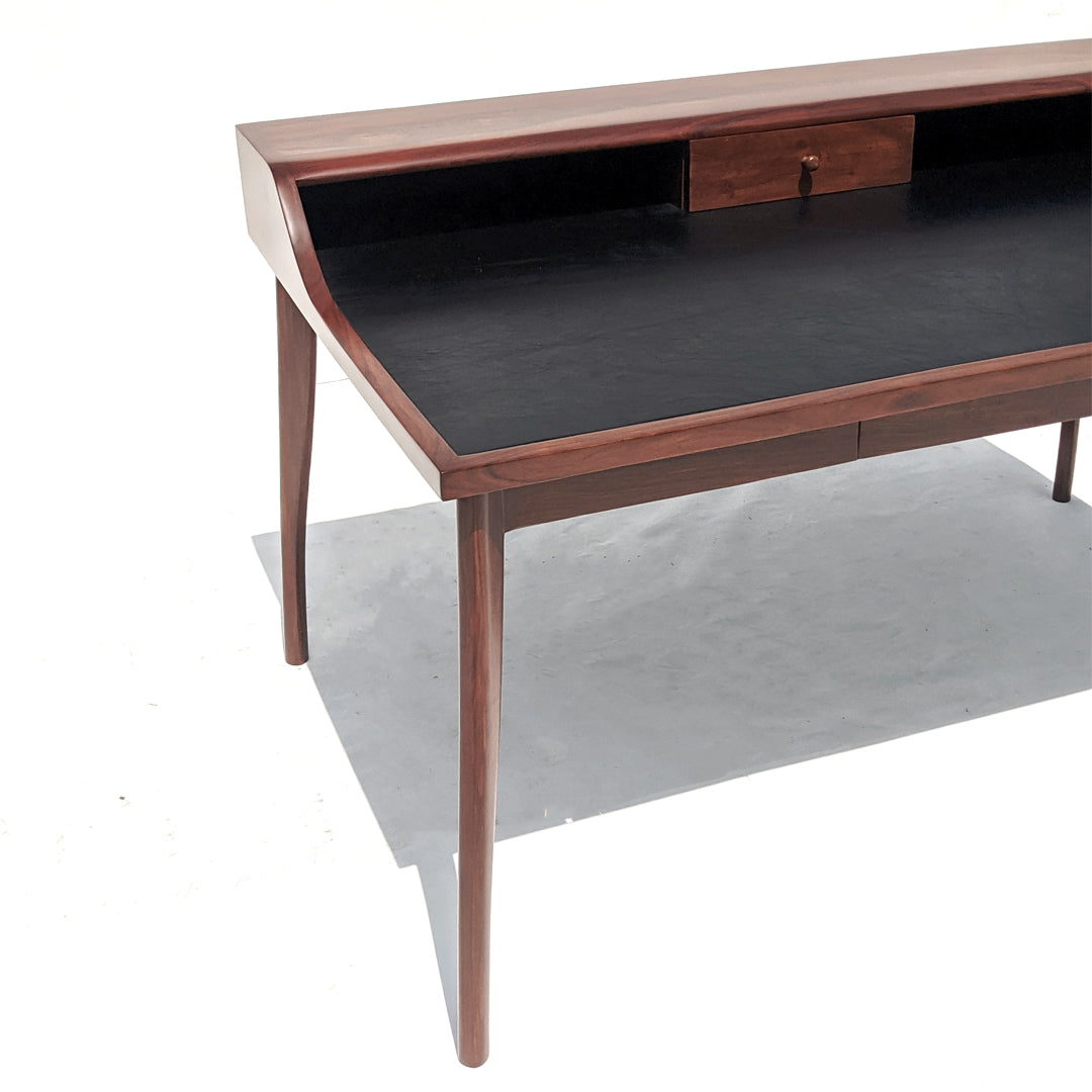 Spacious desk with ample tabletop workspace and two convenient storage drawers.