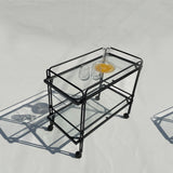 A sleek steel and tempered glass trolley, offering ample space for elegant entertaining